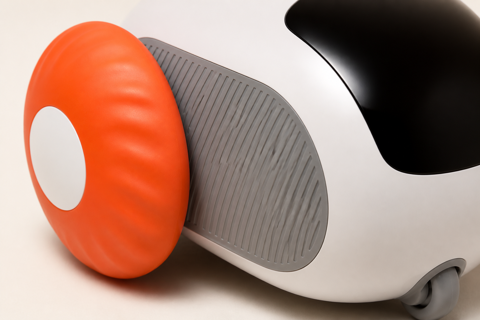 Macro detail of PREYMODE's orange ribbed wheel and gray side panel