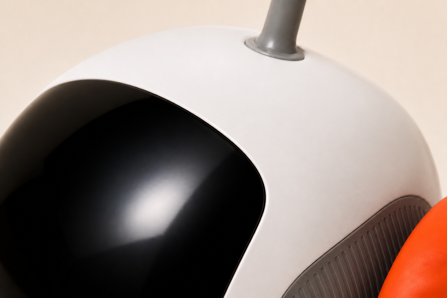 Close-up of PREYMODE's glossy black canopy, smooth white shell and feather-wand base